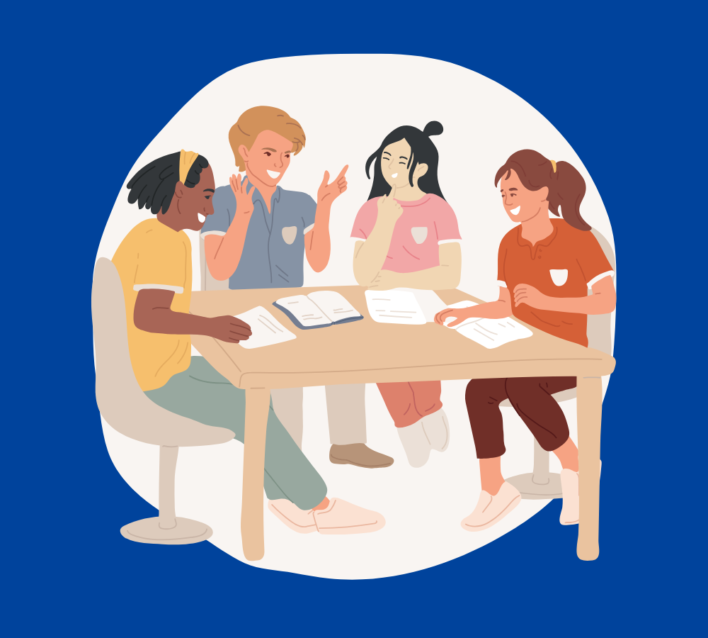 A group of people having a conversation at a table.